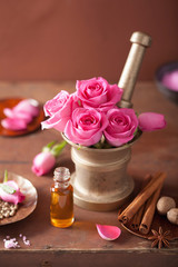 spa and aromatherapy set with rose flowers mortar and spices