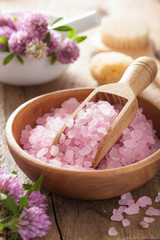 Obraz na płótnie Canvas spa with pink herbal salt and clover flowers