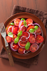 healthy tomato salad with onion basil olive oil and balsamic vin