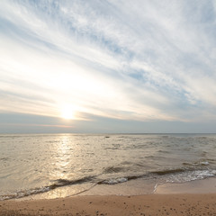 Shoreline of Baltic sea beach with rocks and sand dunes
