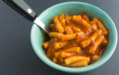 Close view of macaroni in a beef tomato sauce