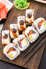 Sushi roll with salmon, tuna and eel