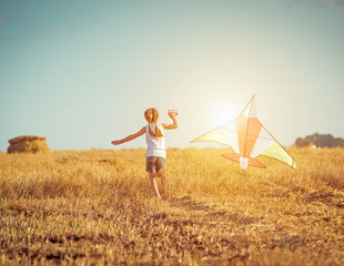 happy little girl with a kite