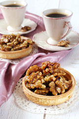 Two cups of coffee and a French dessert, Walnut caramel tart