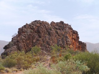 Fototapeta na wymiar Corroboree Rock is an outstanding dark grey column of dolomite