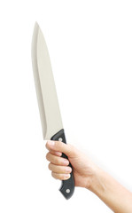 Woman hand is holding a kitchen knife