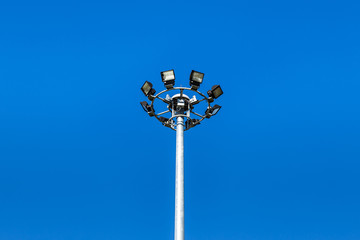 spotlights pillar on blue sky background