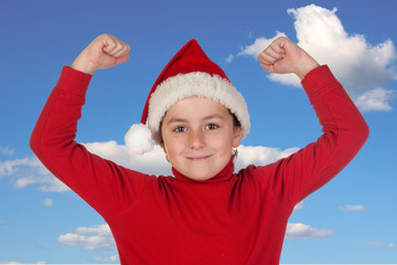Obraz premium Happy child with Christmas hat celebrating something
