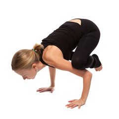 Young woman doing yoga on a white background