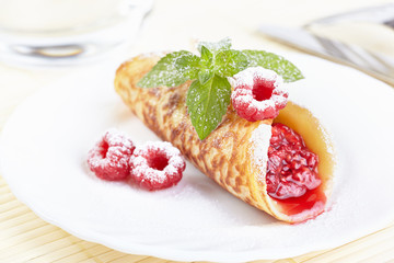 Dessert. Pancake with raspberry jam