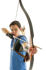 Boy aiming with bow an arrow - 72932600