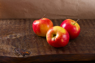 red apples on a wooden table still life