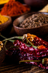 Traditional Asian concept with spices in wooden bowls