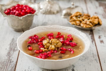 Turkish dessert Ashura, Noah's pudding, with pomegranate seeds and walnuts	
