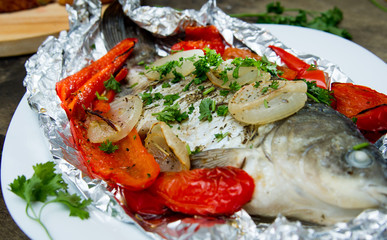 baked fish with bell peppers, onions and herbs