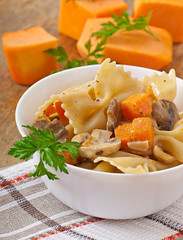 Pasta in cream sauce with slices of pumpkin and mushroom