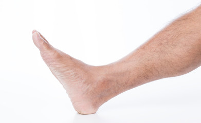 Man foot on white background