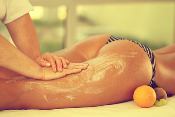 Legs and buttocks massage in the spa center oranges