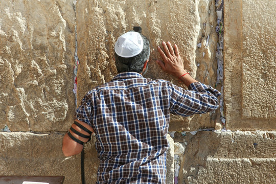 Jewish orthodox man pray at the western wall