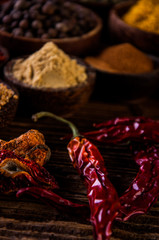 Wooden table of traditional Asian spices