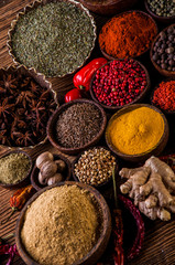 Obraz na płótnie Canvas Variability of Asian spices on wooden table