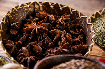 Variability of Asian spices on wooden table