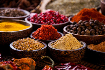 Oriental hot spices on wooden table