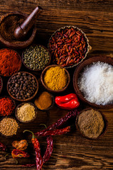 Oriental hot spices on wooden table
