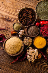 Oriental hot spices on wooden table