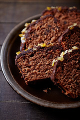 Chocolate cake with glaze and orange peel