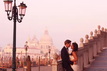 Fotobehang Beautiful wedding couple in Venice on their honeymoon © hreniuca