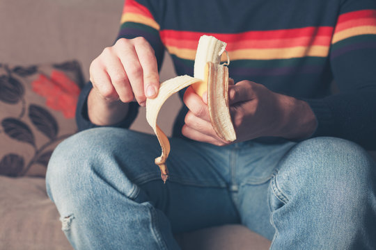 Young man with a banana