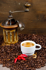 Coffee Grinder with Beans and coffe cup