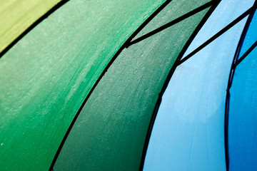 A close up shot of Rainbow coloured umbrella