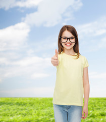 smiling cute little girl in black eyeglasses