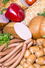 sausages on a wooden plate with vegetables in a restaurant