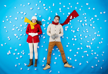 Young couple in winter studio having fun