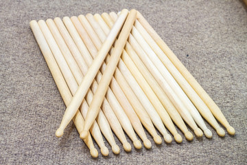 Drumsticks laid out on the floor.