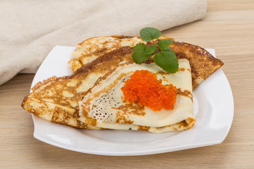 Pancakes with red caviar