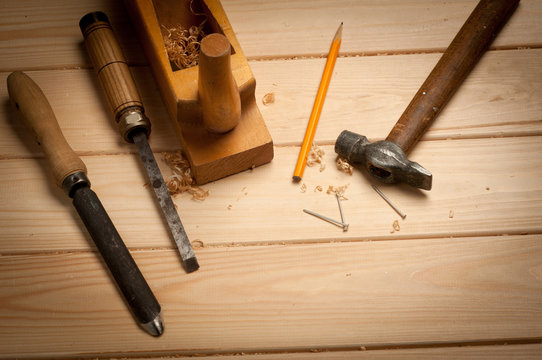 carpenter tools in pine wood table