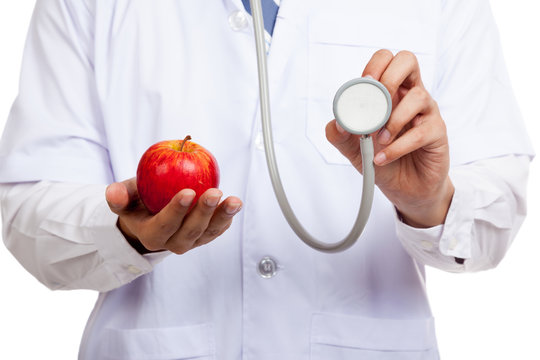 Asian male doctor with stethoscope and apple