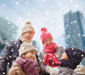 happy family in winter clothes outdoors
