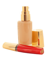 luxury foundation and lip gloss isolated on white