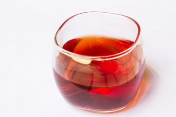 Tea in a glass on a white background.
