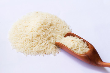 Rice and spoon in isolate on white.