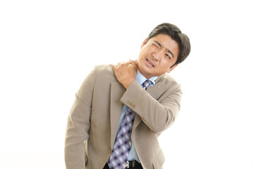 肩痛を訴えるビジネスマン