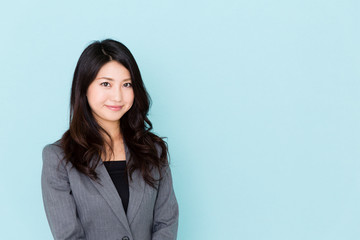 asian businesswoman on blue background