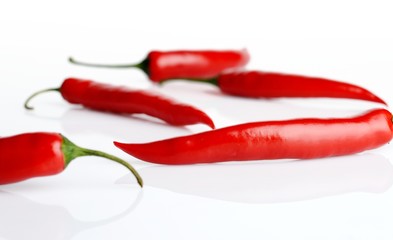 Studio shot of chilli peppers on white