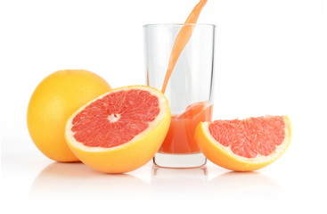 Fototapeta na wymiar Studio shot sliced grapefruits with poured juice on white