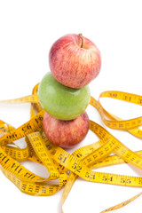 healthy diet concept , apple and a measuring tape